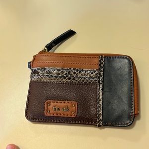 The Sak wallet with card pockets and one larger zipper pocket.
